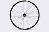 Crank Brothers Synthesis Alloy XCT rear mountain bike wheel with I9 hub, featuring a sleek black rim and durable components for mountain biking