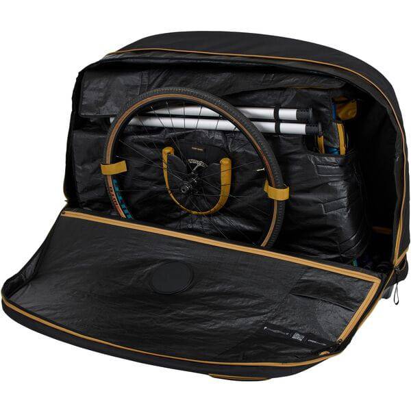 Thule RoundTrip MTB bike case with integrated work stand, showing a sturdy bike storage and maintenance solution for mountain and road bikes.