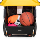 Burley Bee bike trailer for one child with safety harness and weather cover, outdoor accessories for safe cycling.