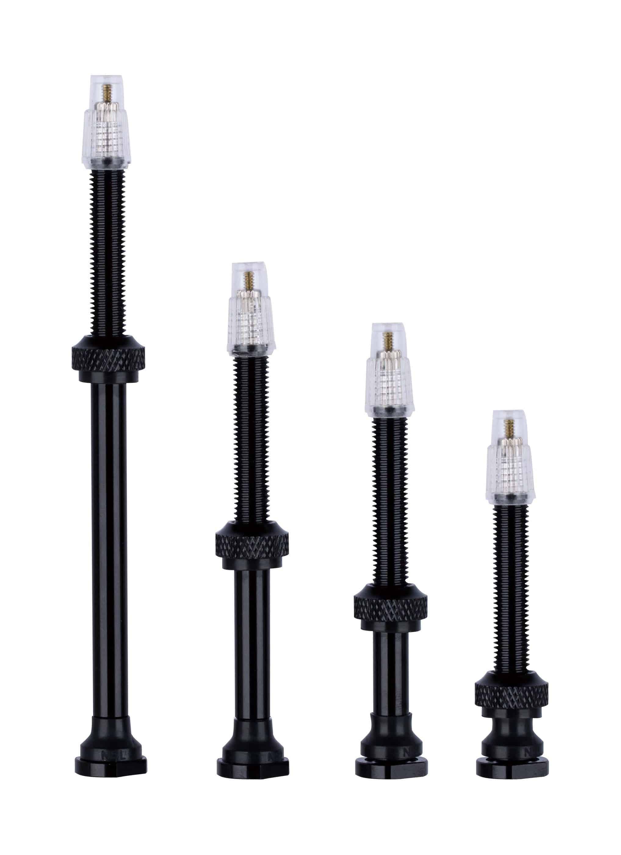 Black Vision tubeless valves for TLR carbon rims, compatible with tubeless wheel systems, shown installed on bike wheels.
