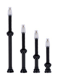 Black Vision tubeless valves for TLR carbon rims, compatible with tubeless wheel systems, shown installed on bike wheels.