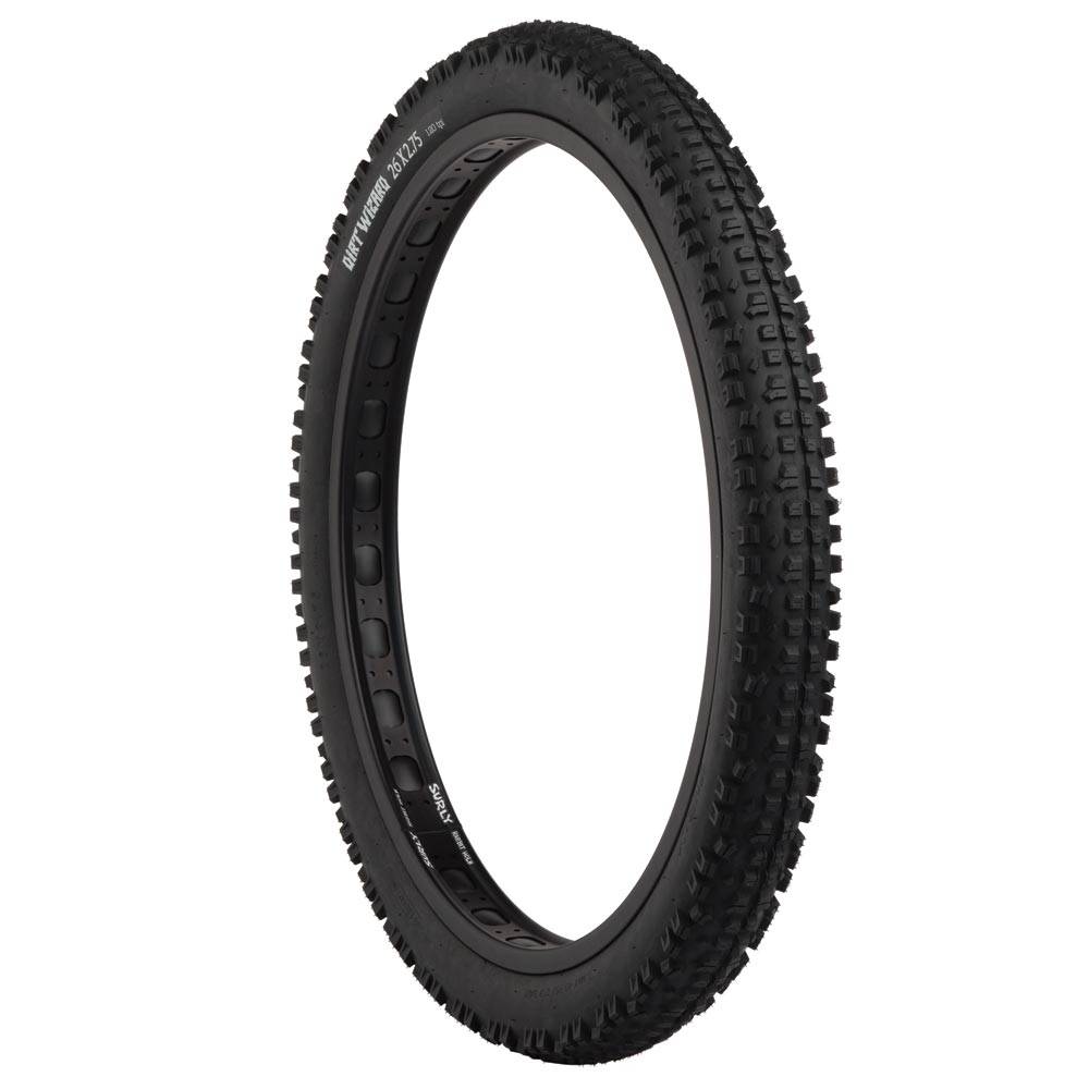 Surly Dirt Wizard 26+ tubeless-ready mountain bike tire with aggressive tread for 50mm rims, designed for off-road riding.