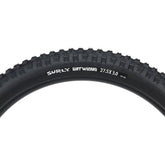 Surly Dirt Wizard 27.5+ 3-inch tubeless-ready folding bead mountain bike tire with rugged tread for off-road riding.