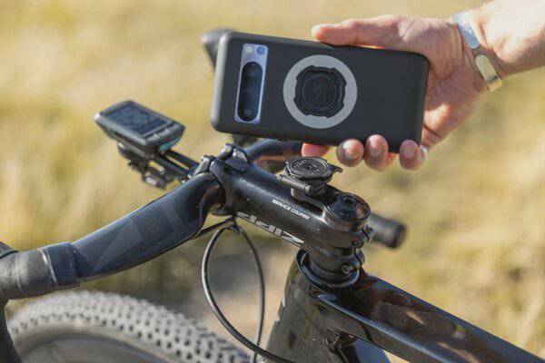 Quad Lock stem cap mount for bike handlebars, compatible with 28.6mm stems, provides secure smartphone attachment for cycling.