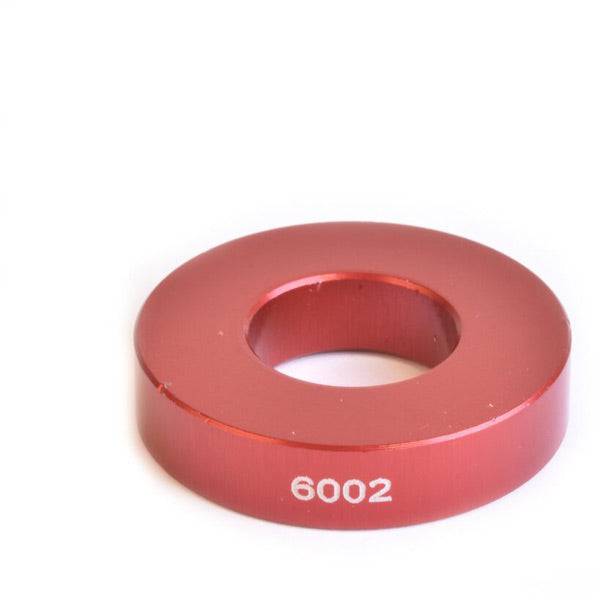 Workshop tool by Wheels Manufacturing for installing 6002 bearings and 15mm axles, part of the Drift Over Axle Kit.