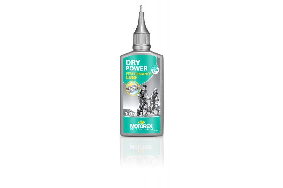 Motorex Workshop Dry Power Lube biodegradable synthetic bike chain lubricant applied to a bike chain in a workshop setting