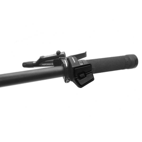 Shimano STEPS SW-E6010 left hand switch for e-bike assist and walk mode control, mounted on handlebar.