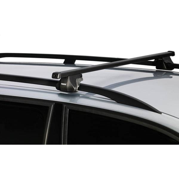 Thule Smart Rack 118cm car roof rack with mounts and spares installed on vehicle roof rails, accessories for secure cargo transport