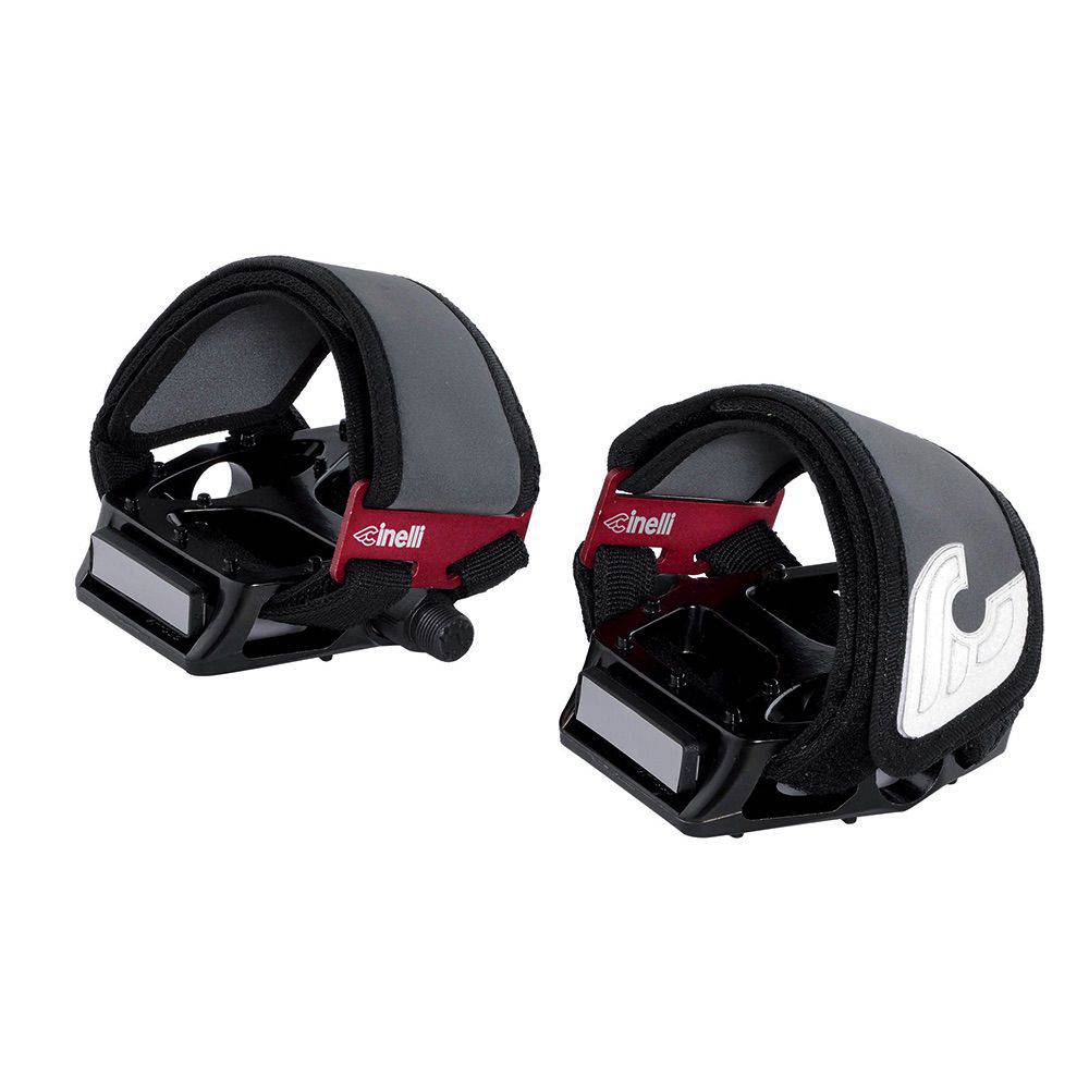 Cinelli Kink Toe Straps with reflective buckles, bike components for secure pedal fit, shown on a bicycle pedal.