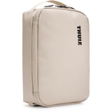 Thule Chasm Medium Gear Cube Soft Sand weather-resistant organizer bag with multiple compartments for accessories.
