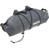 EVOC Handlebar Pack BOA WP 5L waterproof bike pannier with secure fit system mounted on bike handlebar.