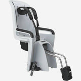 Thule RideAlong 2 rear child bike seat attached to bike, adjustable for kids aged 9 months to 6 years, with safety harness and padding.