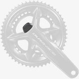 Shimano FC-R9200-P top cover replacement part for crankset components, showing the sleek metal finish and detailed design.