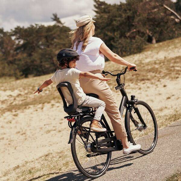 Urban Iki Junior bike seat with carrier mount in Bincho Black, foldable child seat designed for safe bike riding.