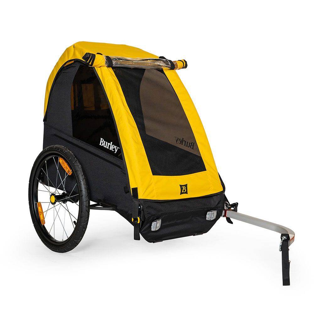 Burley Bee bike trailer for one child with safety harness and weather cover, outdoor riding accessories for kids.