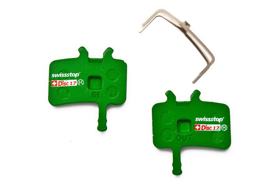 SwissStop Disc 17 brake pads for AVID Juicy, AV, and BB7 green disc brakes, close-up of green brake pad components.