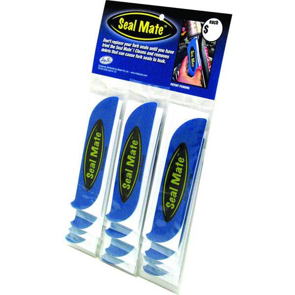 Motion Pro Seal Mate fork seal cleaner tool pack of 12 for motorcycle maintenance, shown in a workshop setting.