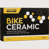Gtechniq Bike Ceramic Kit in workshop setting showing bottles of durable 24-month protective coating for bikes.