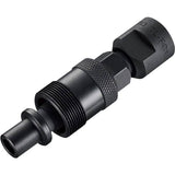 Shimano TL-FC11 cotterless crank extractor tool for bike maintenance, positioned on a workshop workbench.