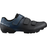 Shimano XC1W women's mountain bike shoes with SPD clips and hook-and-loop straps, designed for off-road cycling comfort and performance.