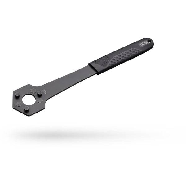 PRO Cassette Wrench for 10T and 11T cassettes with 3-pin secure grip, used in bike workshop settings.