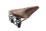 Brooks Flyer softened tan leather bike saddle with steel rails, 175mm, unisex touring bike component, close-up view