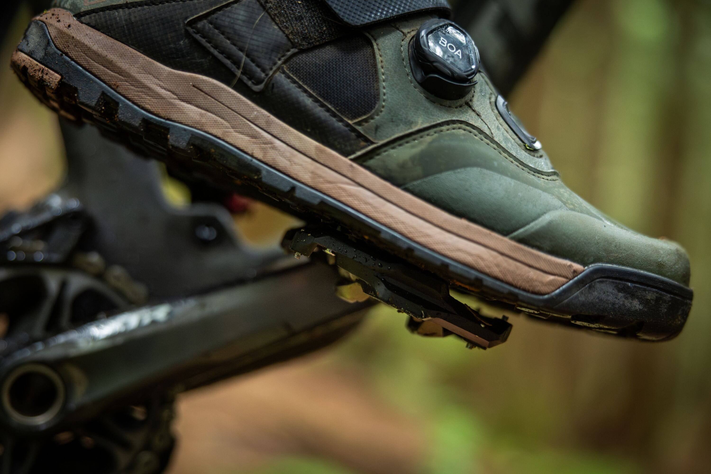 Shimano XTR PD-M9220 trail wide platform mountain biking pedals with black body and metal pins for enhanced grip and durability.