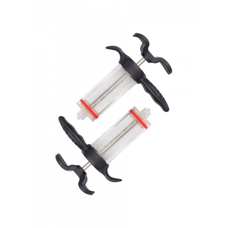 Jagwire Elite Mineral Brake Bleed Kit with 2 ergonomic syringes for mineral fluid systems, shown in a workshop setting