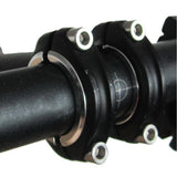 Genetic handlebar shims for split-clamp stems, bicycle components accessory, showing black rubber shims installed on handlebars.