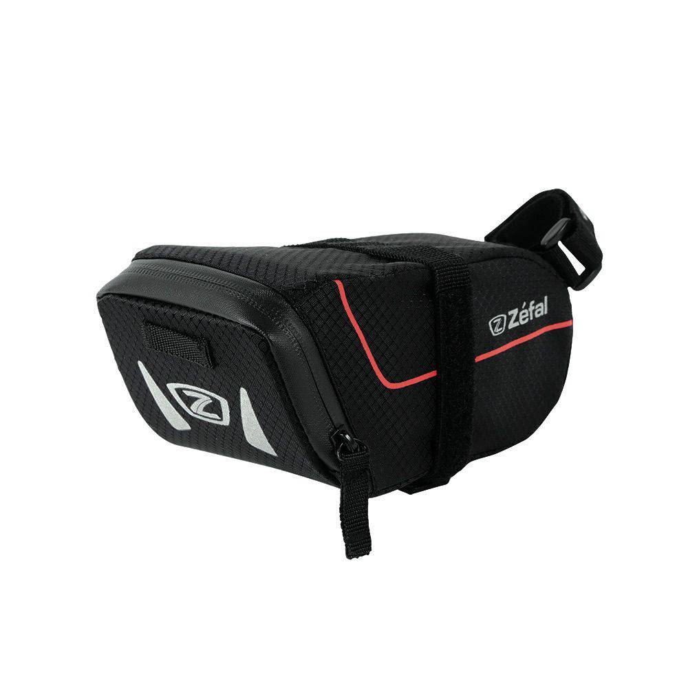 Zefal Z Light Saddle Pack with reflective stripes and light mount attached to a bike seat for storage and visibility.