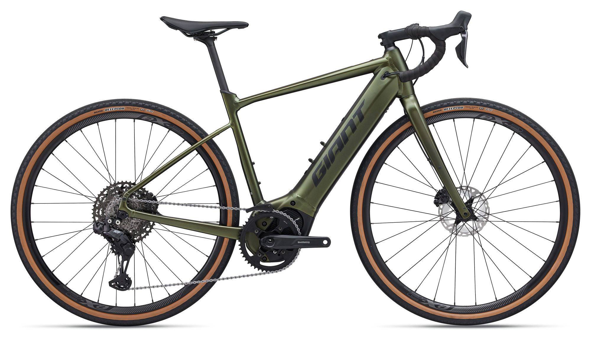Giant Revolt E+ 1 2026 electric gravel bike with powerful motor and disc brakes, shown outdoors on a gravel trail.