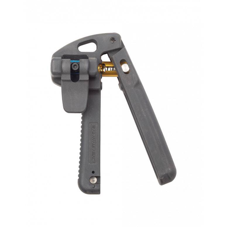 Jagwire Pro Needle Driver Tool in black, used for precise installation of 5.0 and 5.5mm hydraulic hose fittings in a workshop setting.