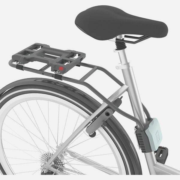 Urban Iki TA-KE rear child seat for e-bike, mounted on bike frame, with safety harness and comfortable padding for young riders.