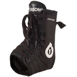 SixSixOne Race Brace Pro ankle support in black, slim and comfortable, designed for unisex use, shown on a model.