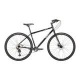 Surly Bridge Club 700c touring bike with drop handlebars and rugged frame, designed for versatile multi-surface adventure riding.