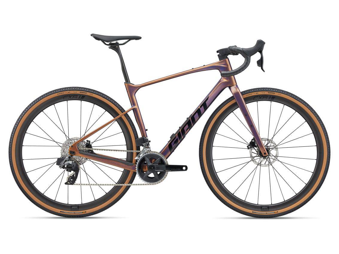 Giant Revolt Advanced Pro 1 gravel bike with adjustable wheelbase and integrated storage, shown in profile on a trail.