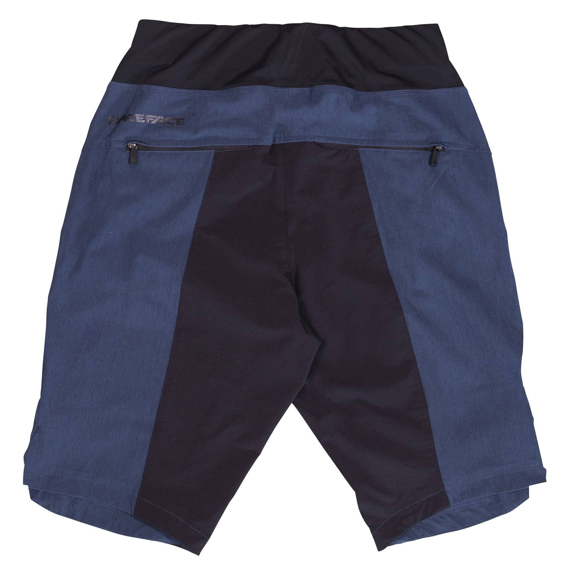 Race Face Traverse women's mountain biking shorts with zippered pockets and ventilation for active outdoor riding.