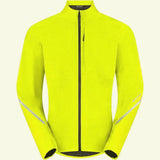 Madison men's waterproof cycling jacket with reflective safety features, shown in a natural outdoor setting.