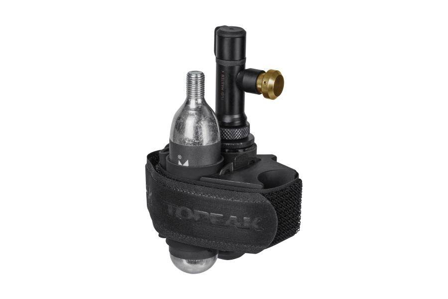 Topeak Tubi Master X 2-in-1 tubeless tyre repair and CO2 inflator kit for bike workshops, with tools and components laid out.