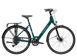 Trek Verve Lowstep hybrid bike with Shimano CUES drivetrain, featuring a comfortable step-through frame and urban riding tires.
