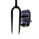 Silver Passport Lug-Kage Rack with adjustable straps securing luggage and gear, shown holding a bag.