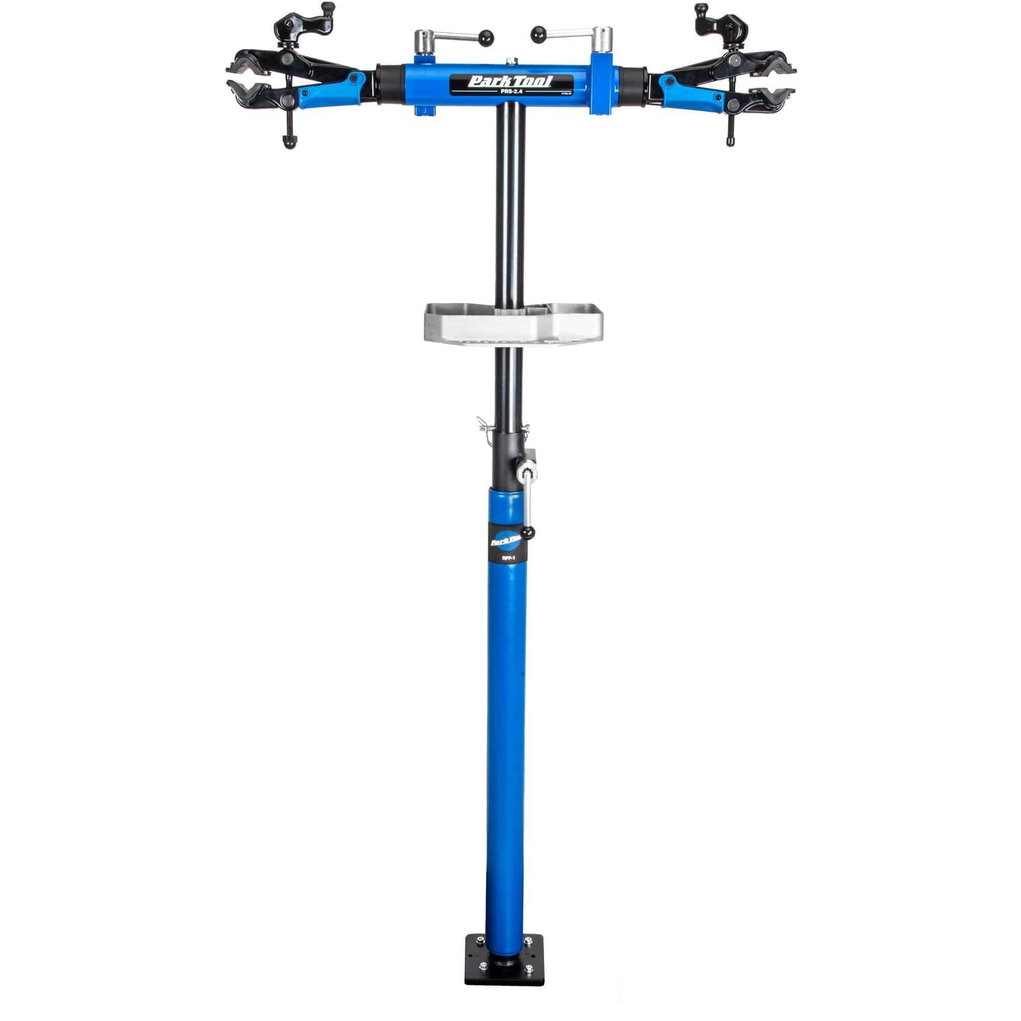 Park Tool PRS-2.4-2 Deluxe double arm bike repair stand with 100-3D clamps, suitable for bike maintenance workshops.