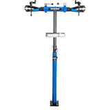 Park Tool PRS-2.4-2 Deluxe double arm bike repair stand with 100-3D clamps, suitable for bike maintenance workshops.