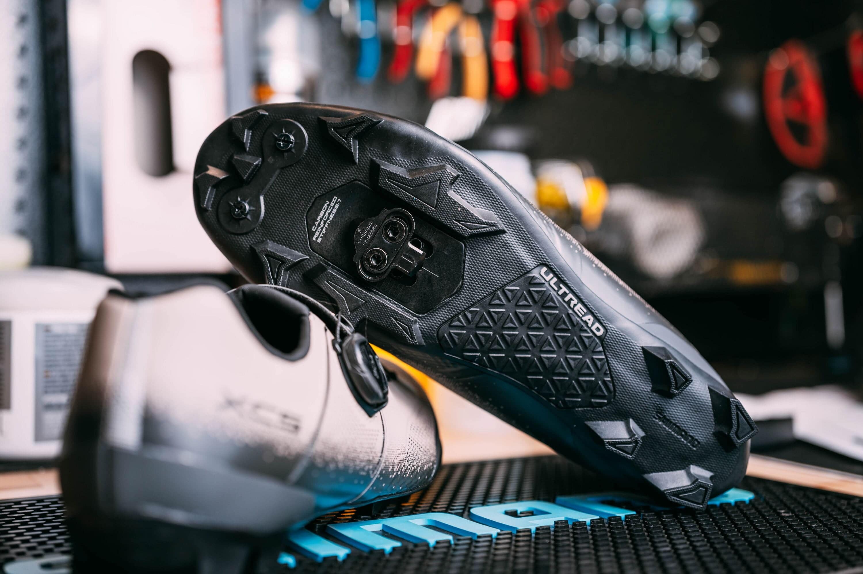 Shimano MT001 MTB SPD cleats with multi-entry design for mountain biking, gravel, and cyclocross pedals, showing the cleat profile.