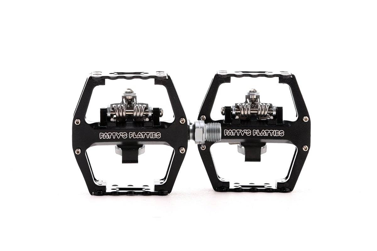 Fat Spanner MTB clip stud pedal with Shimano-compatible cleats and sealed bearings, shown mounted on a mountain bike pedal platform.