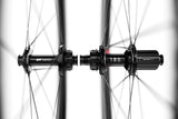 DT Swiss ARC 1100 DICUT carbon clincher front wheel with disc brake and tire, 85 x 22 mm rim for high-performance cycling.