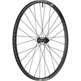 DT Swiss XM 1700 29-inch front mountain bike wheel with 30mm rim and 15x110mm BOOST axle, showing the wheel's tread and rim details.
