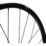 Shimano GRX WH-RX180 700C front tubeless-ready disc clincher wheel with 12x100mm axle and sleek black design.