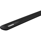 Black Thule Wing Bar Evo aluminium roof bar with aerodynamic mounts, shown in a close-up view for vehicle roof accessory installation.