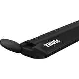 Black Thule Wing Bar Evo aluminum roof bar with aerodynamic mounts for vehicle roof rack accessories.